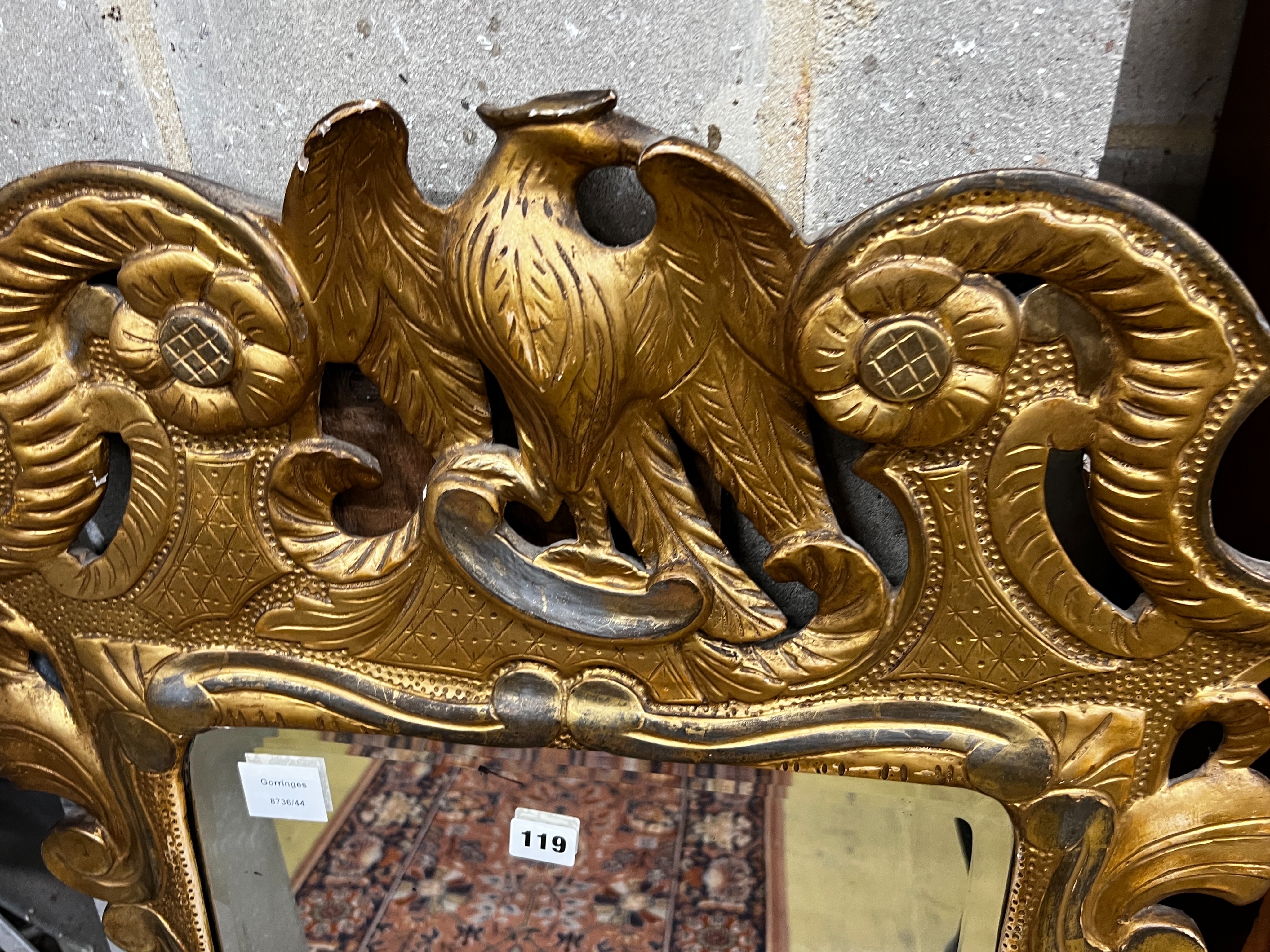 An 18th century style carved giltwood wall mirror, width 62cm, height 105cm